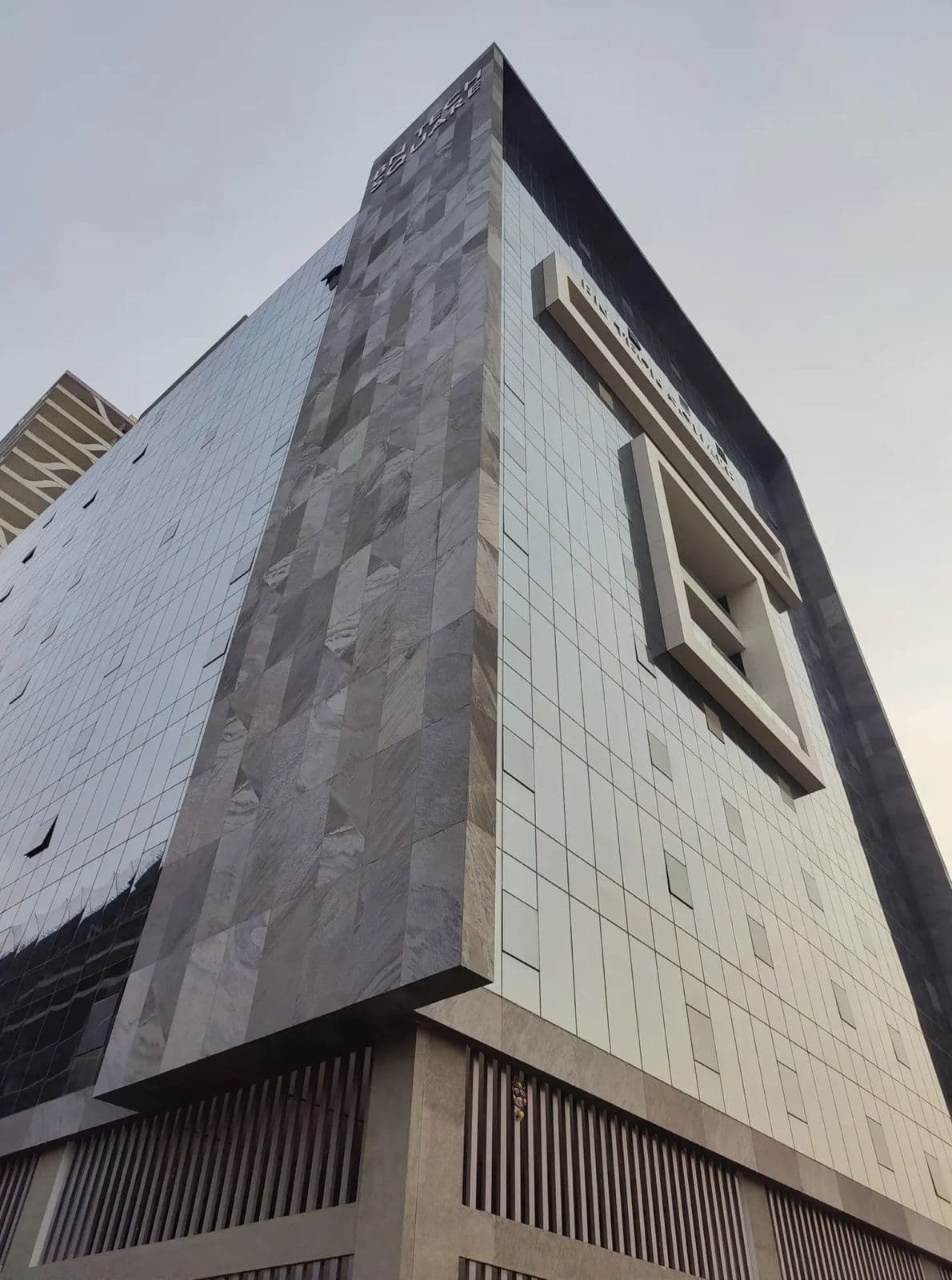 Modern kitchen with arched window and tropical plants
